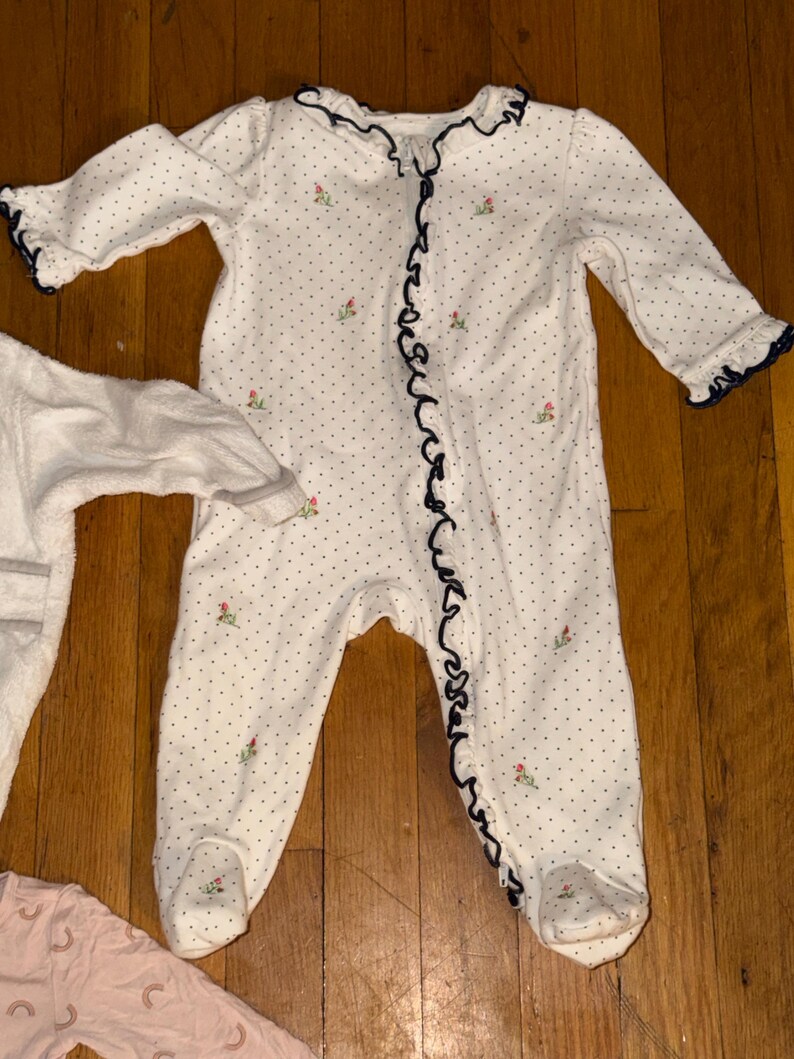 May include: A set of three ceramic mugs with a speckled, matte finish. The mugs are in shades of cream, light gray, and dark gray. Each mug has a simple, minimalist design, perfect for coffee or tea.