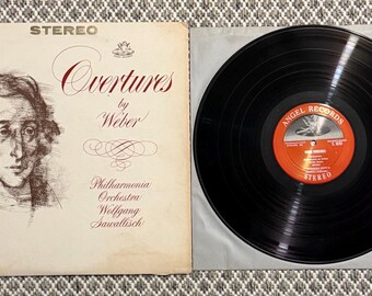 Overtures by Weber performed by the Philharmonia Orchestra and conducted by Wolfgang Sawallisch on the Angel Records label.