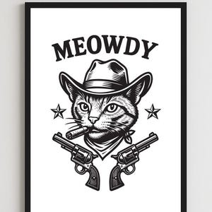 May include: Black and white framed art print featuring a cat wearing a cowboy hat and bandana, smoking a cigar, and holding two revolvers. The word "MEOWDY" is printed above the cat's head.