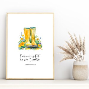 May include: A watercolor painting of yellow rain boots with a quote about faith. The quote reads "I will walk by faith even when I cannot see" with the scripture reference "2 Corinthians 5:7".