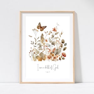 Op de afbeelding: Een aquarelprint met een vlinder- en bloemenontwerp in tinten bruin, oranje en groen. De print bevat de tekst "Ik ben een kind van God" en de bijbelverwijzing "1 Johannes 3:1".