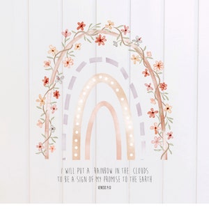 May include: A watercolor illustration of a rainbow with a floral garland around it. The rainbow is in shades of pink, orange, and yellow. The text "I WILL PUT A RAINBOW IN THE CLOUDS TO BE A SIGN OF MY PROMISE TO THE EARTH GENESIS 9:13" is below the rainbow.