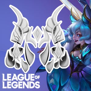 May include: A set of white, stylized, wing-like armor components featuring pointed, curved edges and diamond-shaped accents, displayed alongside a digital illustration of a character with blue hair and the text LEAGUE OF LEGENDS.
