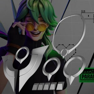 May include: A set of silver-colored metal rings and a necklace with a pointed design. The rings are in different sizes and shapes. The necklace has a small circle pendant. The background is a blurry image of a person wearing sunglasses.