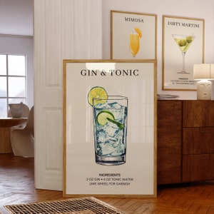 May include: A printable poster with a watercolor illustration of a gin and tonic cocktail. The poster has the title "Gin & Tonic" and lists the ingredients: 2 oz gin, 4 oz tonic water, and a lime wheel for garnish.