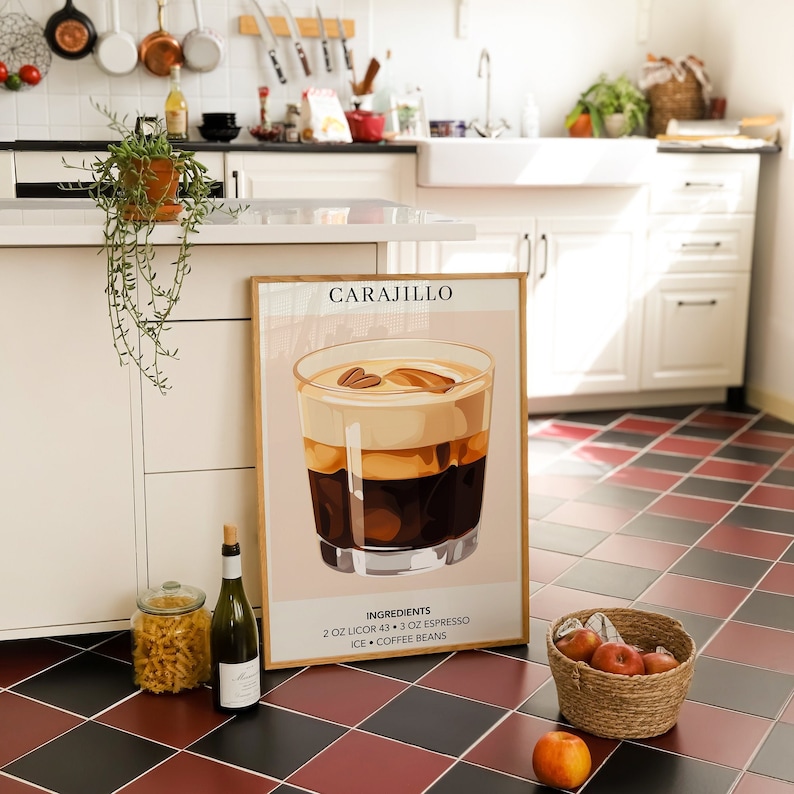 May include: A poster with a pink background and the word "CARAJILLO" in black text. The poster features an illustration of a glass of coffee with a brown and white layered drink. The text below the illustration reads "INGREDIENTS: 2 OZ LICOR 43 + 3 OZ ESPRESSO ICE + COFFEE BEANS".