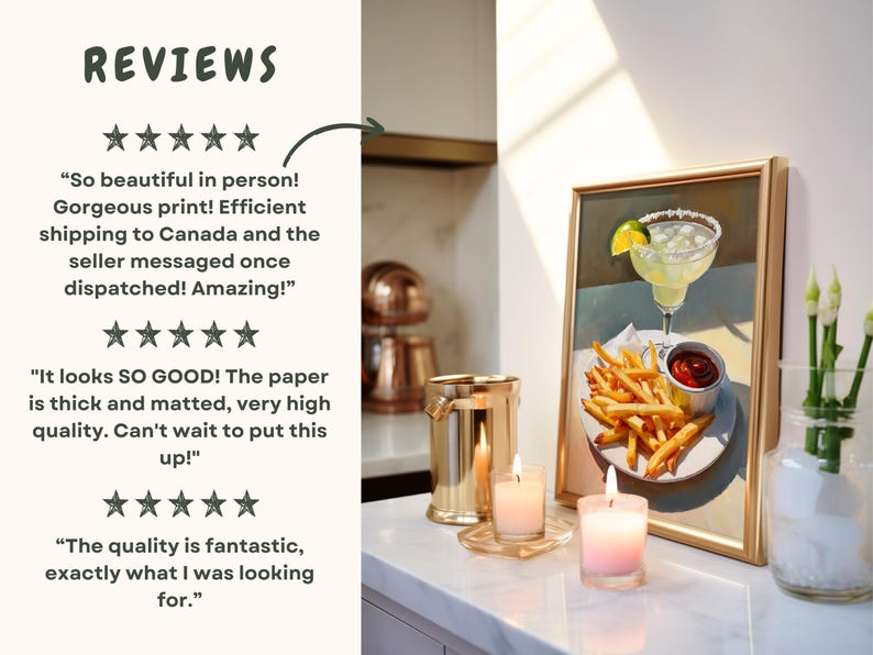 May include: A framed print of a painting depicting a margarita cocktail with a lime wedge, french fries, and a small dish of ketchup. The print is displayed on a white countertop with two candles and a metal ice bucket.