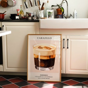 May include: A framed print with a light pink background featuring a glass of Carajillo, a cocktail made with coffee and liquor. The text "Carajillo" is at the top of the print, and the ingredients are listed at the bottom: "2 oz Licor 43, 3 oz Espresso, Ice, Coffee Beans".