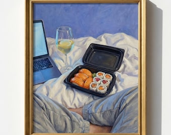 May include: A framed painting shows a laptop, a wine glass with a lemon slice, and a black sushi container on a bed. The sushi includes salmon nigiri and sushi rolls. The painting is in a gold frame.