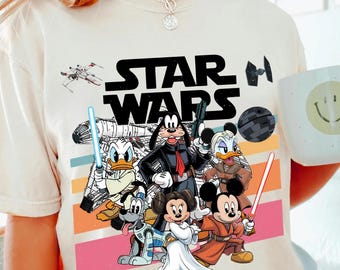 Maglietta di Topolino e i suoi amici di Star Wars, maglietta Disney di Topolino e Han Solo, magliette di Goofy Stormtrooper, maglietta di Paperino Jedi, magliette di Galaxy's Edge