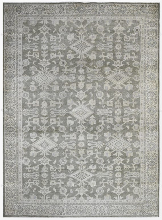 Hand-knotted grey ivory rug with tribal geometric motifs and soft texture – perfect for modern, transitional, and bohemian style interiors