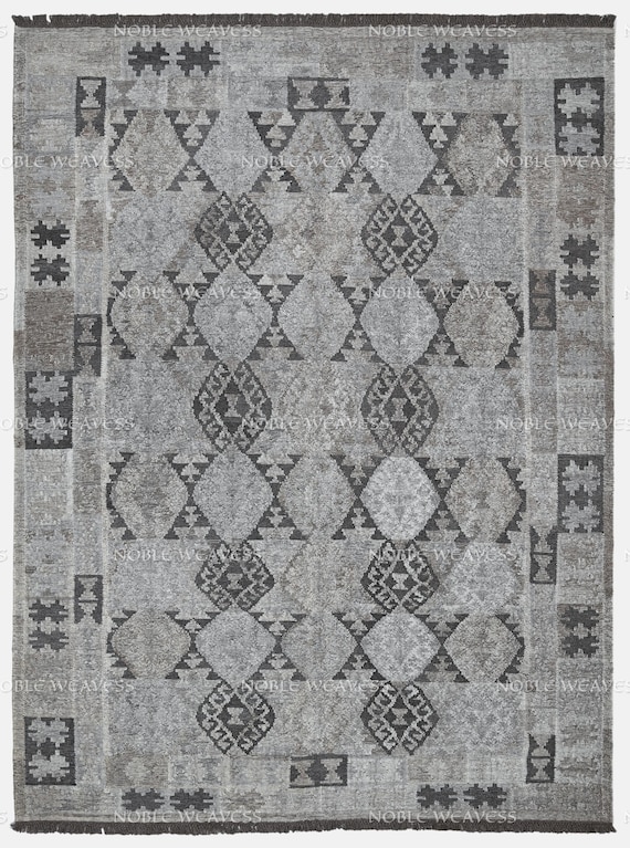 Hand-woven geometric tribal rug in charcoal and silver-grey tones – adds modern heritage style to living rooms, lounges, and entryways