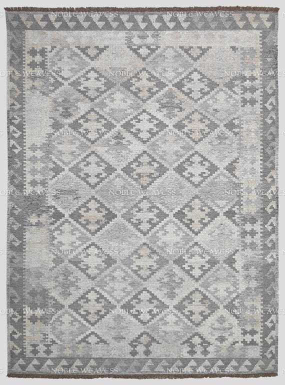 Hand-woven diamond pattern rug in soft grey and beige tones – ideal for modern living rooms, bedrooms, or neutral interior spaces