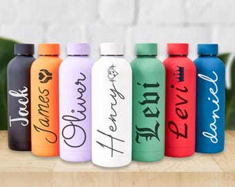 May include: A collection of seven colorful water bottles, each with a different name in a stylish font. The bottles are in various colors, including black, orange, lavender, white, green, red, and blue. Each bottle has a matching colored lid.