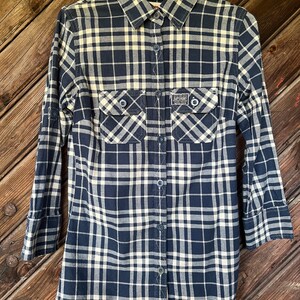 May include: A blue and white plaid long-sleeved button-down shirt with a Superdry logo patch on the left chest.