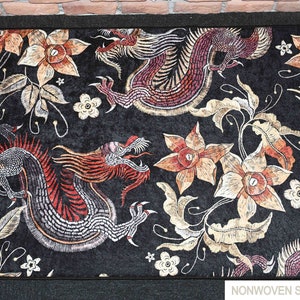 May include: Black rug with a floral and dragon design. The rug has a soft, non-woven texture. "NONWOVEN SOFT RUG" is printed in the bottom right corner.
