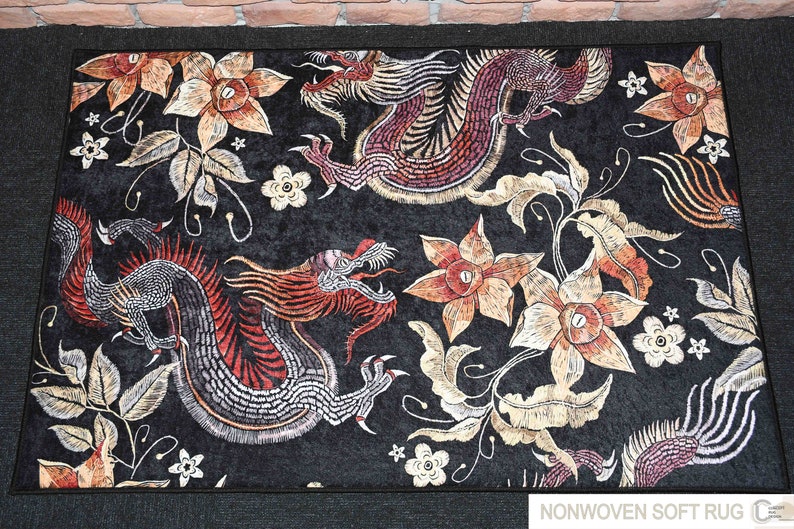May include: Black rug with a floral and dragon design. The rug has a soft, non-woven texture. "NONWOVEN SOFT RUG" is printed in the bottom right corner.