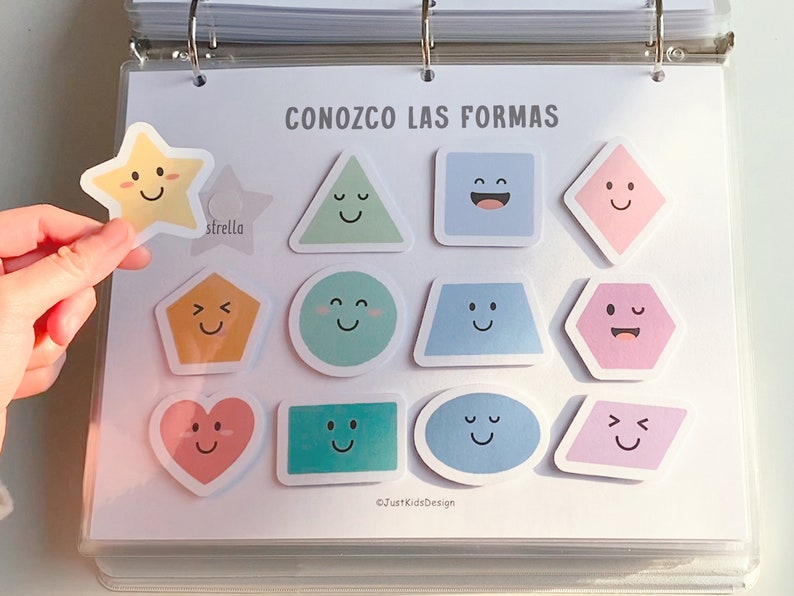 May include: A set of colorful stickers featuring different shapes with smiling faces. The shapes include a star, triangle, square, diamond, pentagon, circle, trapezoid, hexagon, heart, rectangle, oval, and parallelogram. The text "CONOZCO LAS FORMAS" is printed at the top of the page.