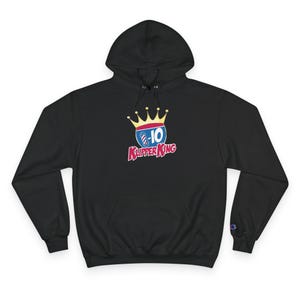 May include: Black hooded sweatshirt with a front pocket and a Champion logo on the left sleeve. The sweatshirt features a colorful graphic of a crown, a barber's pole, and the text "10 Klipper King" in red and blue.