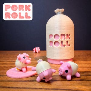 May include: A whimsical display featuring a cylindrical container with the words "PORK ROLL" cut out, alongside several pink pig figurines. The container has a light beige body and a pink base. The pig figurines are pink with beige accents.