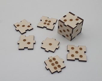 May include: A wooden puzzle with six pieces that form a cube. Each piece has a different number of dots on it, from one to six. The pieces are all the same size and shape, and they fit together perfectly to form a cube.