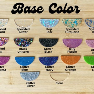 May include: A selection of 16 different glitter and speckled resin base colors for crafting. The colors include: Speckled Unicorn, Speckled Glitter, Pop Star, Speckled Turquoise, Speckled Blue, Confetti Pop, Black Unicorn, Glitter Black, Jelly Purple, Glitter Pink, Glitter Magenta, Glitter Blue, Glitter Navy, Glitter Orange, Glitter Lime, Glitter Silver, and Clear.