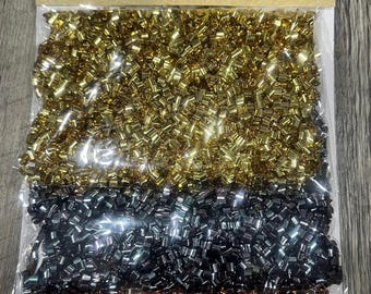 May include: Three bags of tube confetti in gold, silver, and bronze colours. The packaging reads "tube confetti" and "0.74 oz (21 g)". The product is from Crafter's Square.