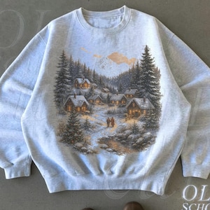 Retro Christmas Winter Village Sweatshirt , 90s Vintage Mountain Pine Trees Decorated Cabins Outfit, Boho Unisex Crewneck Sweatshirt