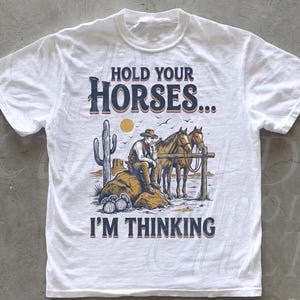 May include: A rustic wooden sign with the text "Welcome to our home" in white lettering. The sign features a distressed finish and a simple, inviting design, perfect for a front porch or entryway.