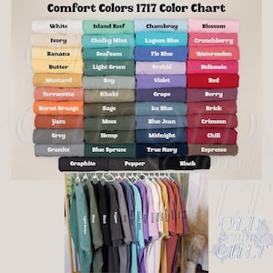 May include: Color chart of Comfort Colors 1717 apparel, featuring a wide array of colors such as white, ivory, banana, and more. Below the chart, a rack displays various t-shirts in the same colors, including black, gray, and blue.