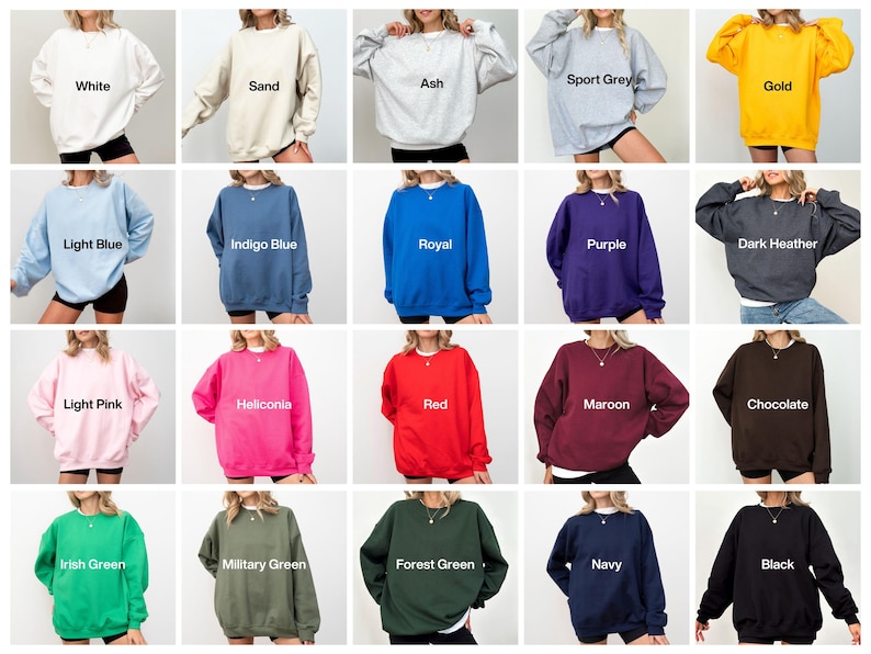 May include: A collection of crewneck sweatshirts in various colors, including white, sand, ash, sport grey, gold, light blue, indigo blue, royal, purple, dark heather, light pink, heliconia, red, maroon, chocolate, irish green, military green, forest green, navy, and black.