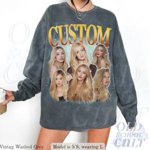 May include: Vintage washed grey sweatshirt with the word "CUSTOM" in gold lettering. The sweatshirt features a collage of six women with long blonde hair. The text "OLD SCHOOL CULT" is printed on the bottom right.