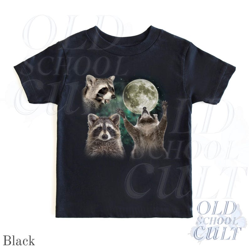 May include: Black t-shirt featuring a graphic of three raccoons and a full moon. One raccoon is looking up at the moon with its arms raised. The text "OLD SCHOOL CULT" is printed on the shirt.