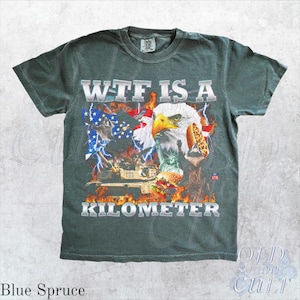 Camiseta WTF Is A Kilometer Divertida Camiseta Patrimonial USA Eagle Gráfico Camiseta Vintage American Meme Camiseta 4 de Julio Retro Unisex Regalo del Día de la Independencia Blue Spruce