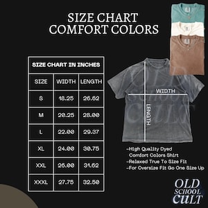May include: A size chart for Comfort Colors shirts, with measurements in inches. The chart includes sizes S to XXXL, with corresponding width and length measurements. The image also shows a gray Comfort Colors shirt and a few other shirt colors.