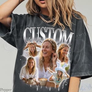 May include: Dark gray t-shirt with the word "CUSTOM" in a silver, metallic font. The shirt features a collage of photos of a person, with a variety of poses and expressions. The shirt has a vintage, distressed look.