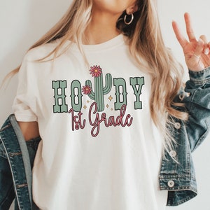 Howdy 1st Grade Teacher Shirt, Comfort Colors Rodeo Teacher Shirt, First Grade Teacher Team Shirt, Western Teacher Gift, Teacher Cowgirl Tee