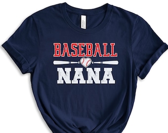 May include: Navy blue t-shirt with a white distressed graphic that says "Baseball Nana" with a red heart and baseball graphic in the middle.
