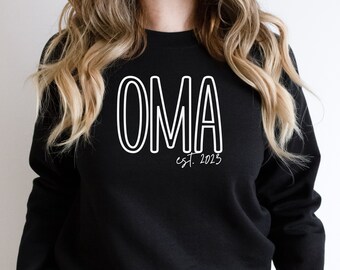 May include: Black sweatshirt with white text that reads "OMA est. 2023".