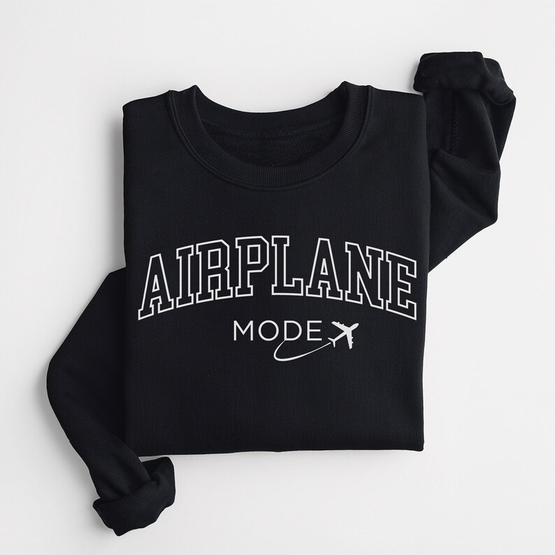 May include: Black sweatshirt with white text that reads "AIRPLANE MODE" with a stylized airplane graphic.