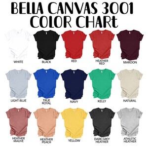 May include: Color chart for Bella Canvas 3001 t-shirts, showing 15 different colors, including white, black, red, heather red, maroon, light blue, true royal, navy, kelly, natural, heather mauve, heather peach, yellow, dark grey heather, and athletic heather.