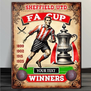 May include: A vintage-style metal sign featuring a soccer player in a red and white striped jersey holding a trophy. The sign reads "Sheffield Utd FA Cup Winners" and lists the years 1899, 1902, 1915, and 1925.