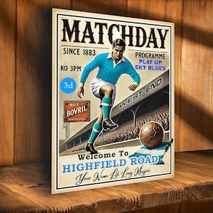 May include: A vintage-style poster for a football match. The poster features a player in a blue jersey kicking a football. The text on the poster reads "Matchday Since 1883", "KO 3PM", "Programme Play Up Sky Blues", "West End", "Hot Bovril Served Here", "Welcome To Highfield Road", and "Your Name Life Long Magpie".