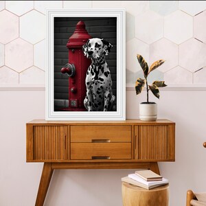 May include: A black and white Dalmatian dog sits next to a red fire hydrant. The dog is looking to the right of the image. The background is a dark grey brick wall.