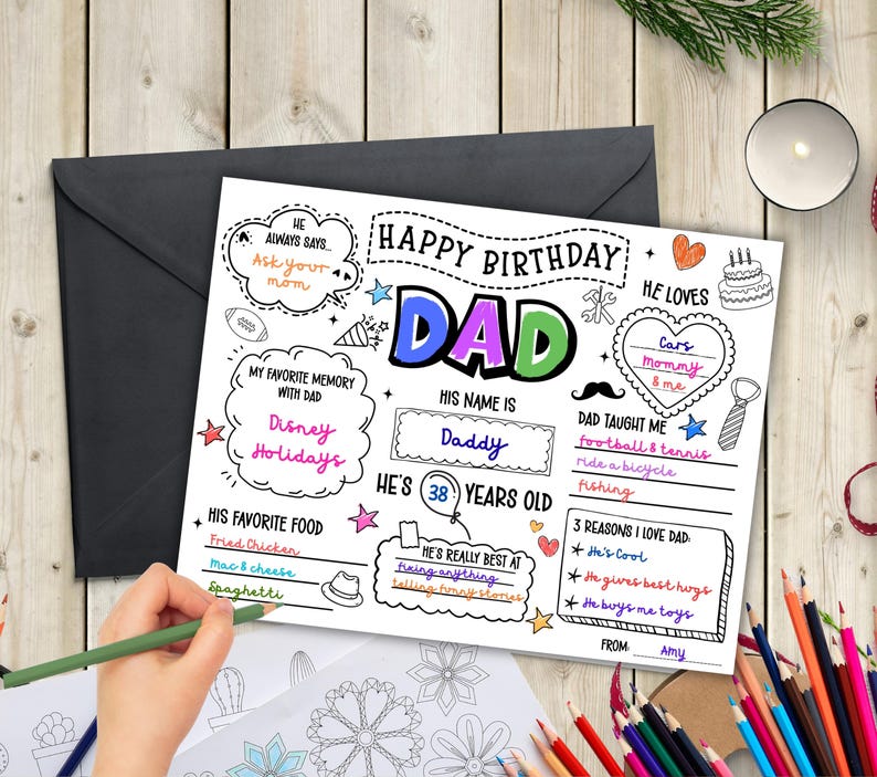 May include: A personalized birthday card with the words "Happy Birthday Dad" in colorful letters. The card includes fill-in-the-blank sections for favorite memories, foods, and reasons for love. A hand is shown coloring the card with a green pencil.