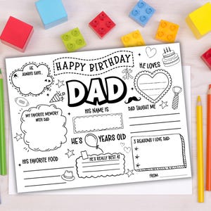 May include: A black and white fill-in-the-blank birthday card for Dad. The card includes spaces for memories, favorite things, and reasons for love, with the words "Happy Birthday Dad" at the top. Colorful pencils and blocks surround the card.