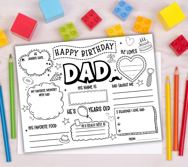May include: A black and white fill-in-the-blank birthday card for Dad. The card includes spaces for memories, favorite things, and reasons for love, with the words "Happy Birthday Dad" at the top. Colorful pencils and blocks surround the card.