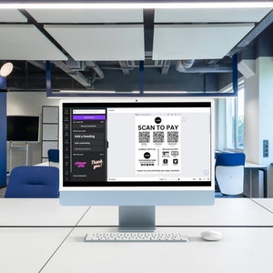 May include: A computer screen displaying a document with the text "SCAN TO PAY" and several QR codes. The document also includes a logo and social media icons. The computer is on a white desk in an office setting.