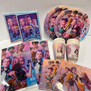 May include: Party supplies set featuring a group of animated characters. The set includes plates, cups, napkins, and two banners. The items are decorated with a colourful design and musical notes.
