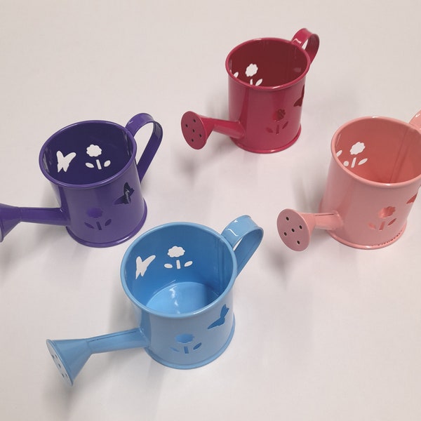 Mini Metal Watering Can Baby Blue ,Baby Pink, Fuchsia, Purple. 2 inches x 2 inches x 4.5 inches. Craft supply with many uses. Great Prices !